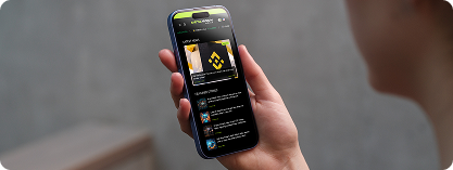 Hand holding smartphone displaying crypto content